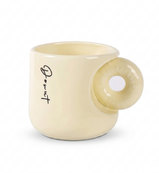 Cream-colored mug with a unique handle design on a white background
